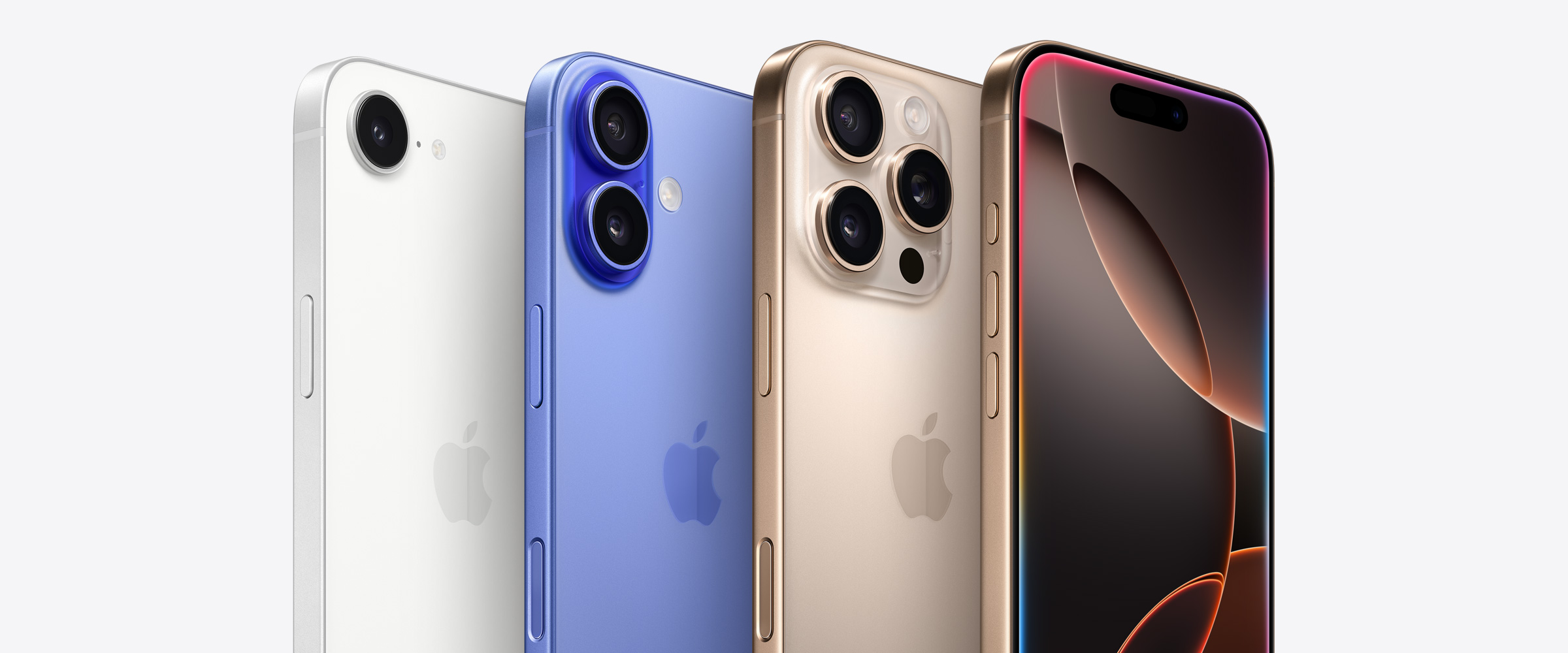 Four iPhone devices, including two iPhone 16 Pro models in Desert Titanium, one showing 3 camera lenses behind the other iPhone 16 Pro showing the Dynamic Island. Next to an iPhone 16 model in Ultramarine showing 2 camera lenses and an iPhone 16e model in White showing 1 camera lens.
